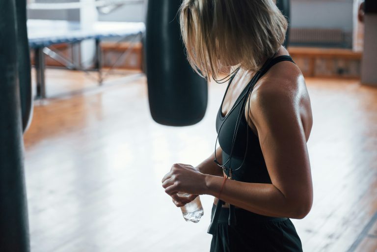 athlete in a gym hydrating