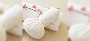 ginger compress in white muslin on a towel