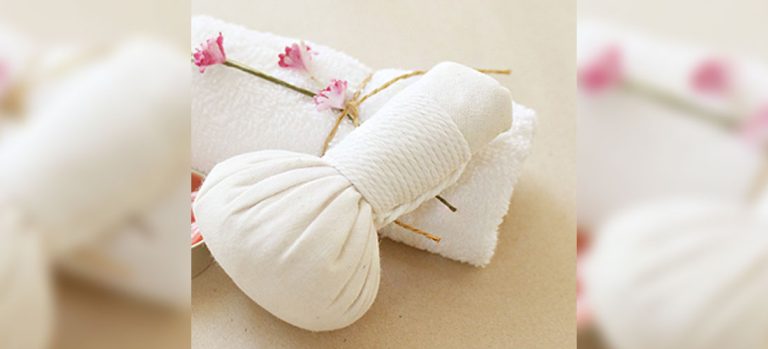 ginger compress in white muslin on a towel