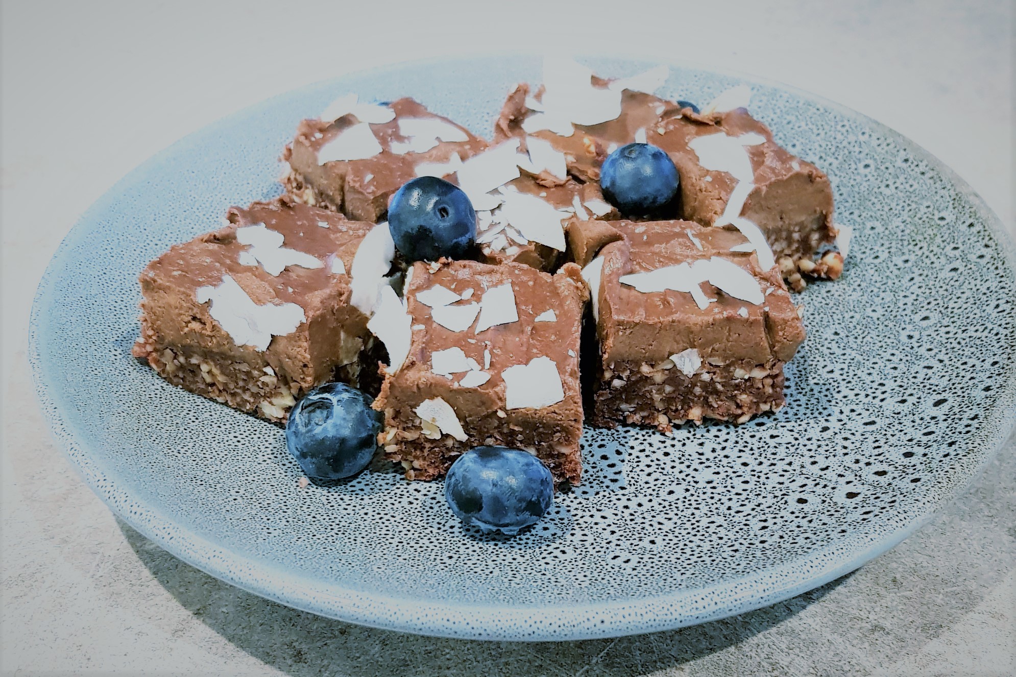 slices on a plate with blueberries